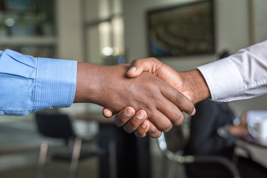Happy customer shaking hands with a Skyward technician